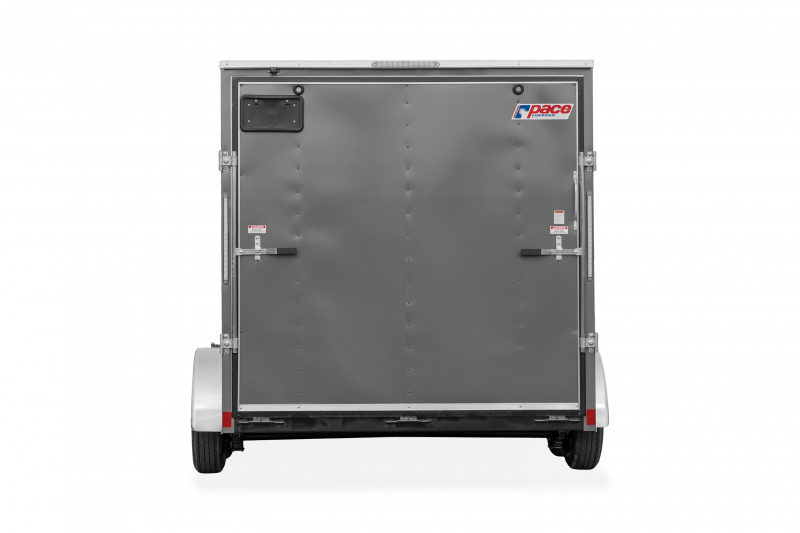 Pace American | Trailers | Trailer Models | Outback DLX | Image of grey enclosed cargo trailer with dual axles showing back of trailer with fold down rear door and a clear background | Image 5