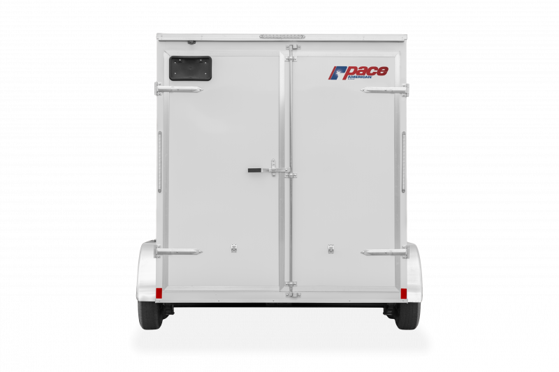 Pace American | Trailers | Trailer Models | Outback DLX | Image of white enclosed cargo trailer with dual axles showing back of trailer with rear double doors and a clear background | Image 8